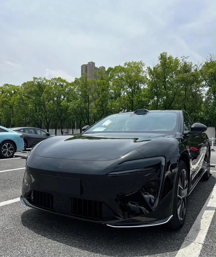 Black electric sedan, front view